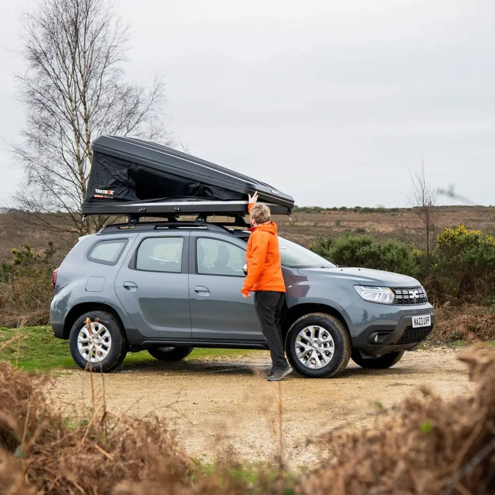 A man opening the classic 2.0 that is fitted to his car