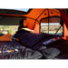 A woman using the TentBox Sleeping bag inside a TentBox Rooftop tent