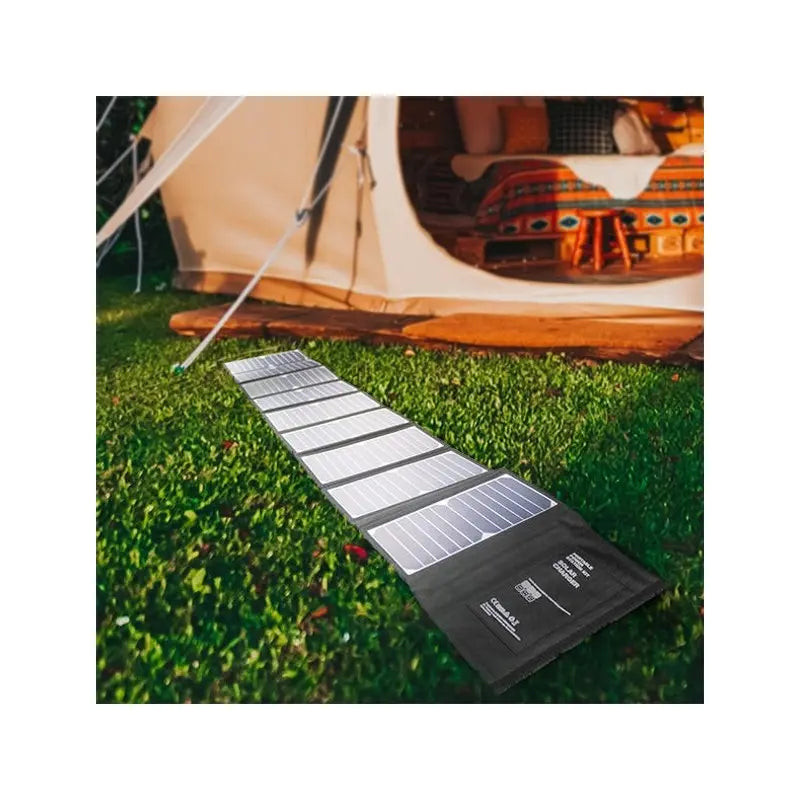 Hyundai H60 60W Portable & Foldable Solar Charger Laying In Grass