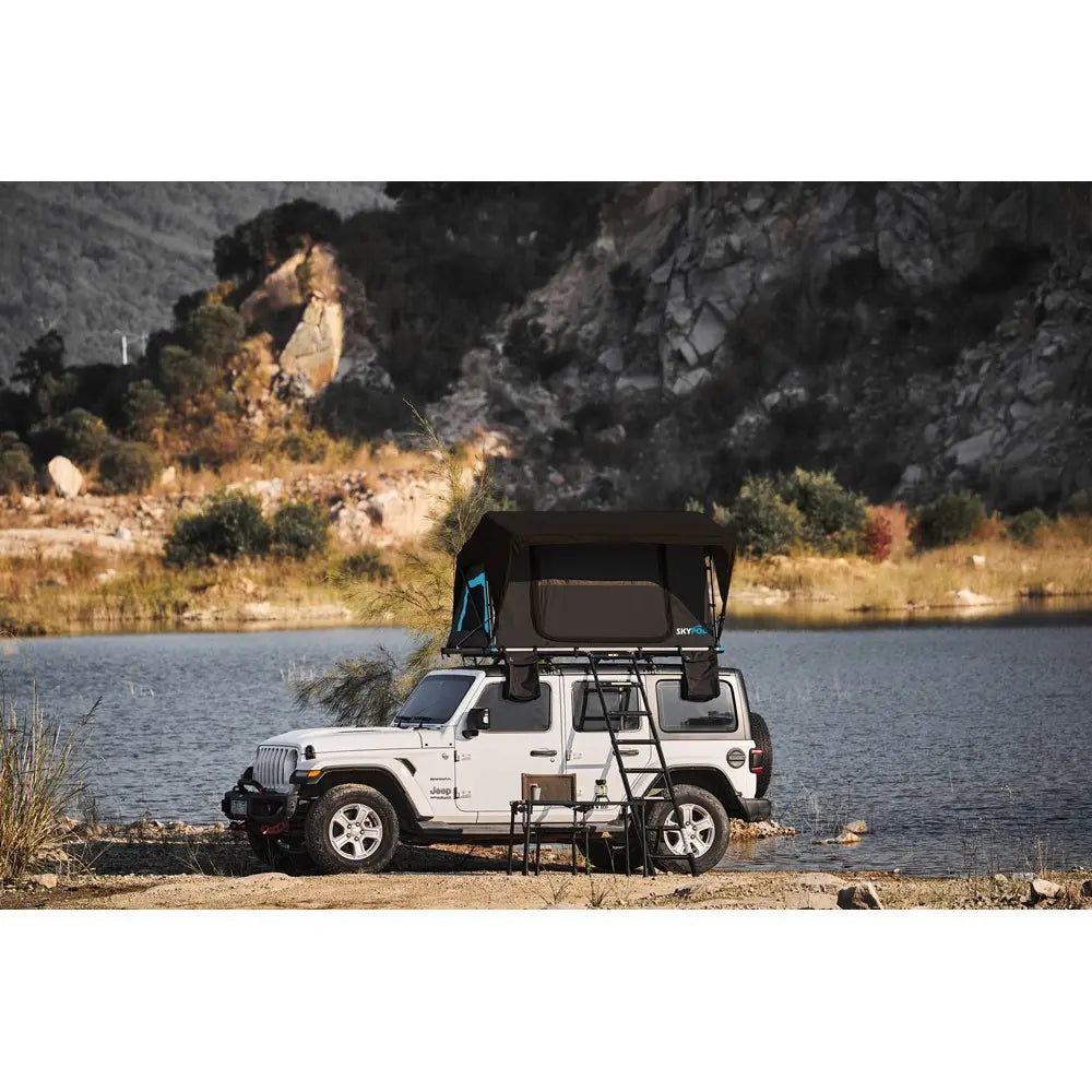 SkyPod Rapide Rooftop Tent on top of 4x4 with mountains in the background