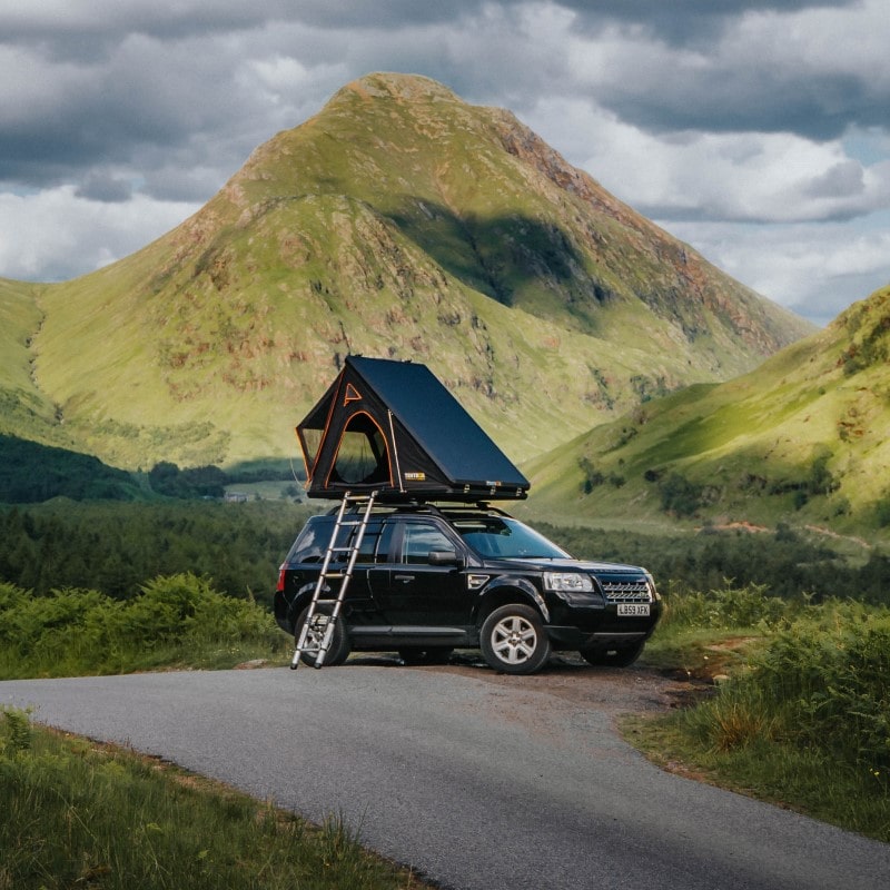 TentBox Cargo Black On Car Roof In front of Mountains