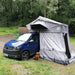 Tuff-Trek PRO-R Rooftop Tent Urban Grey. On Blue Van With Dog sitting there Front Angled View