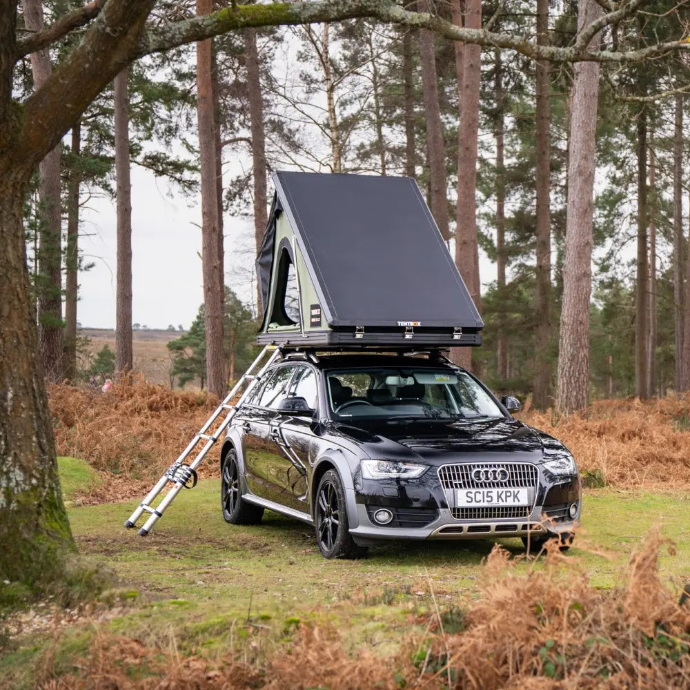 forest green cargo 2.0 on car in field front view