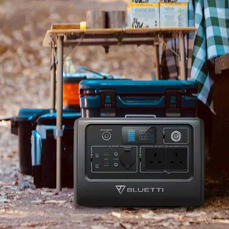 BLUETTI EB70 Portable Power Station Next to Table Outdoors