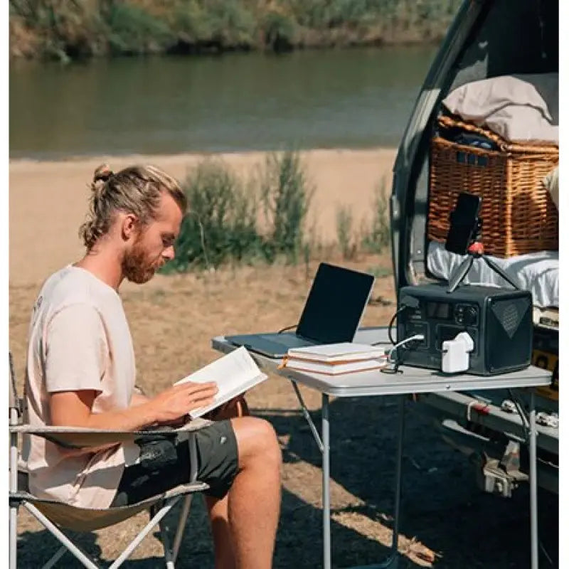 Bluetti EB55 Portable Power Station In use Charging Laptop Outside